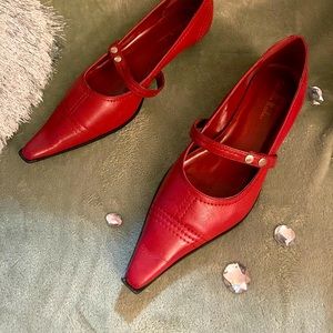 Red Mary Jane kitten heel shoes.